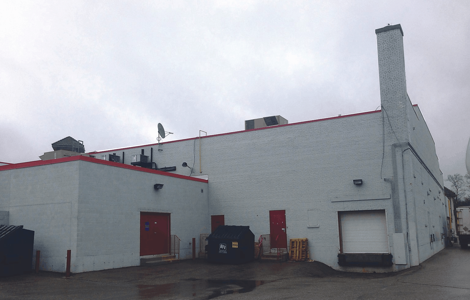 Back of commercial building before painting