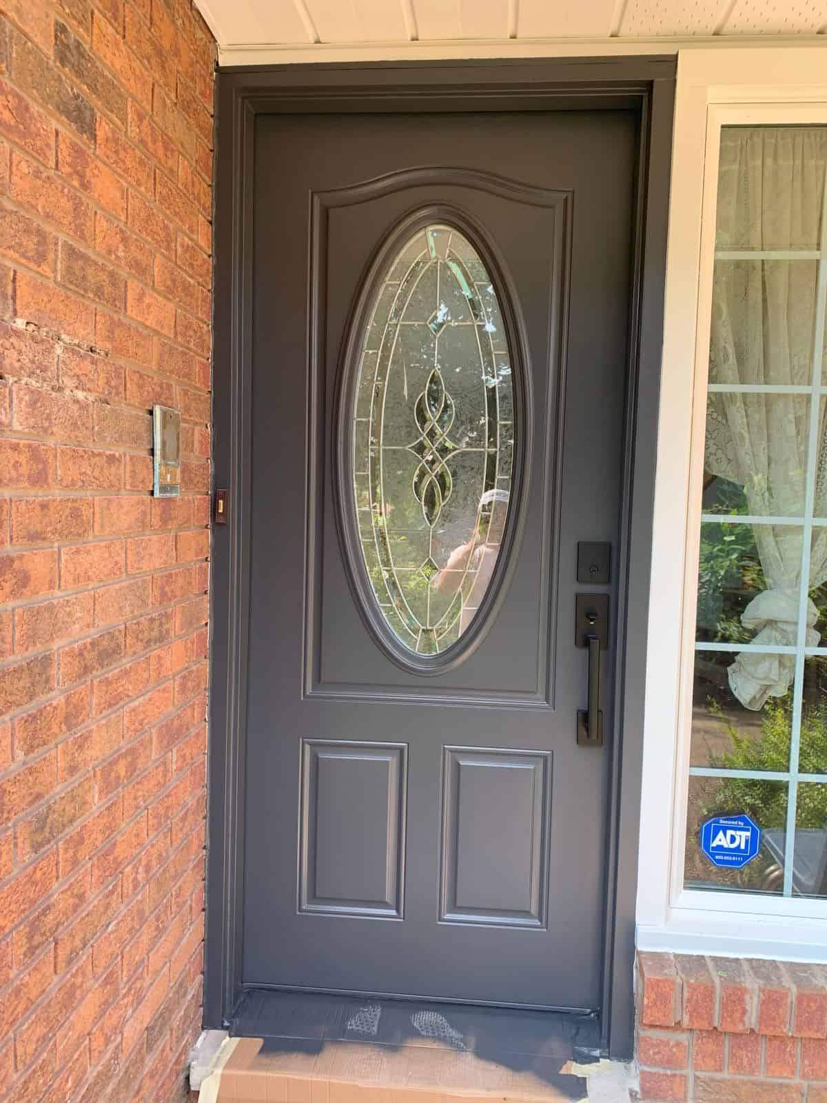 perfect finish on a front door recently painted dark brown by a spray painter.