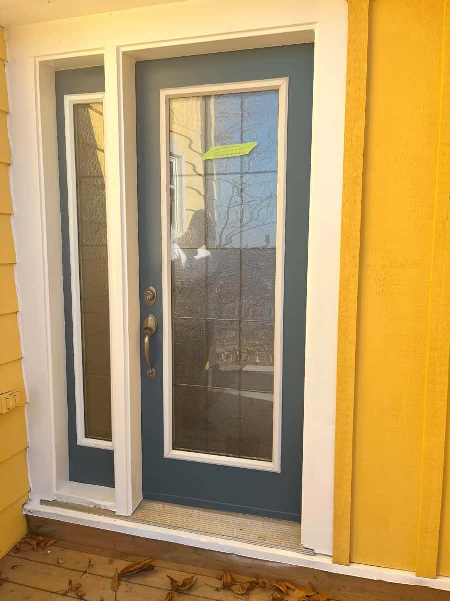 front door painted blue and door trim painted in white.