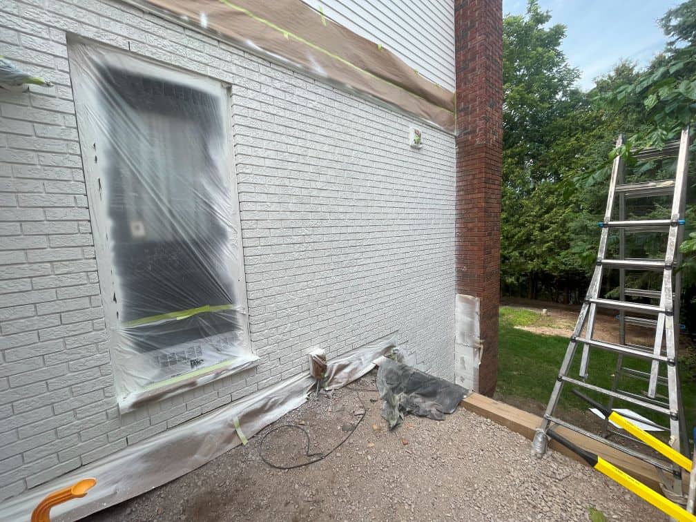 preparation and masking a house for spray painting