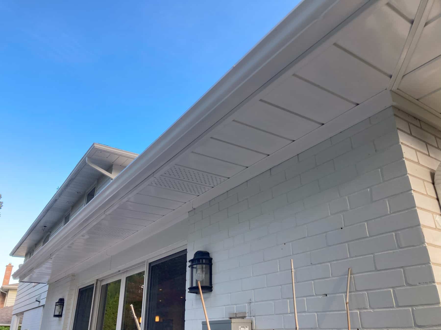 freshly painting and shining soffits, eaves, and fascia on a house